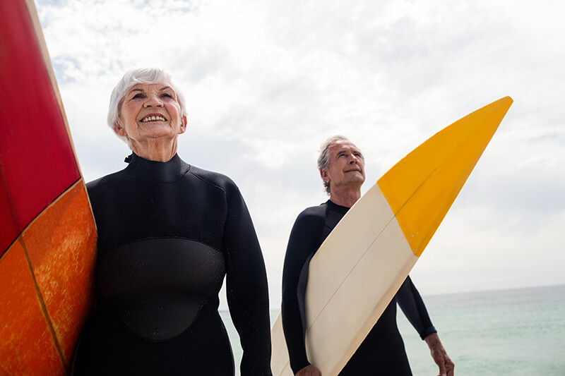 Happy Couple Surfing